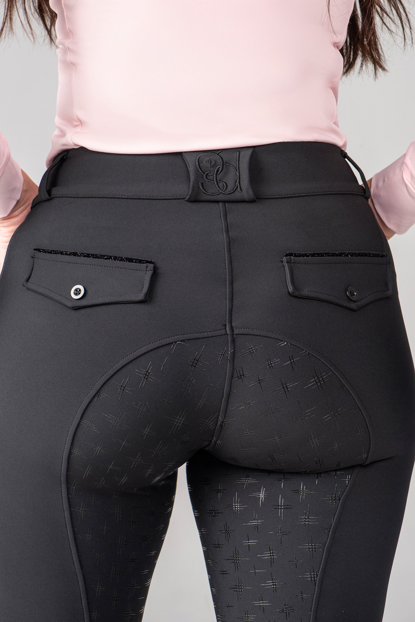 golden dapples black breeches with sparkle pockets and sleek logo accent