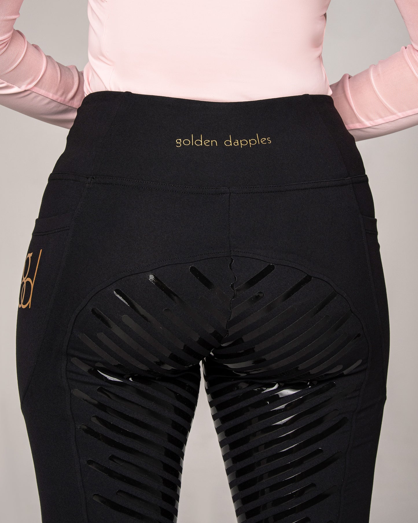 golden dapples pro grip riding leggings in black with gold logo and golden dapples pink sun shirt