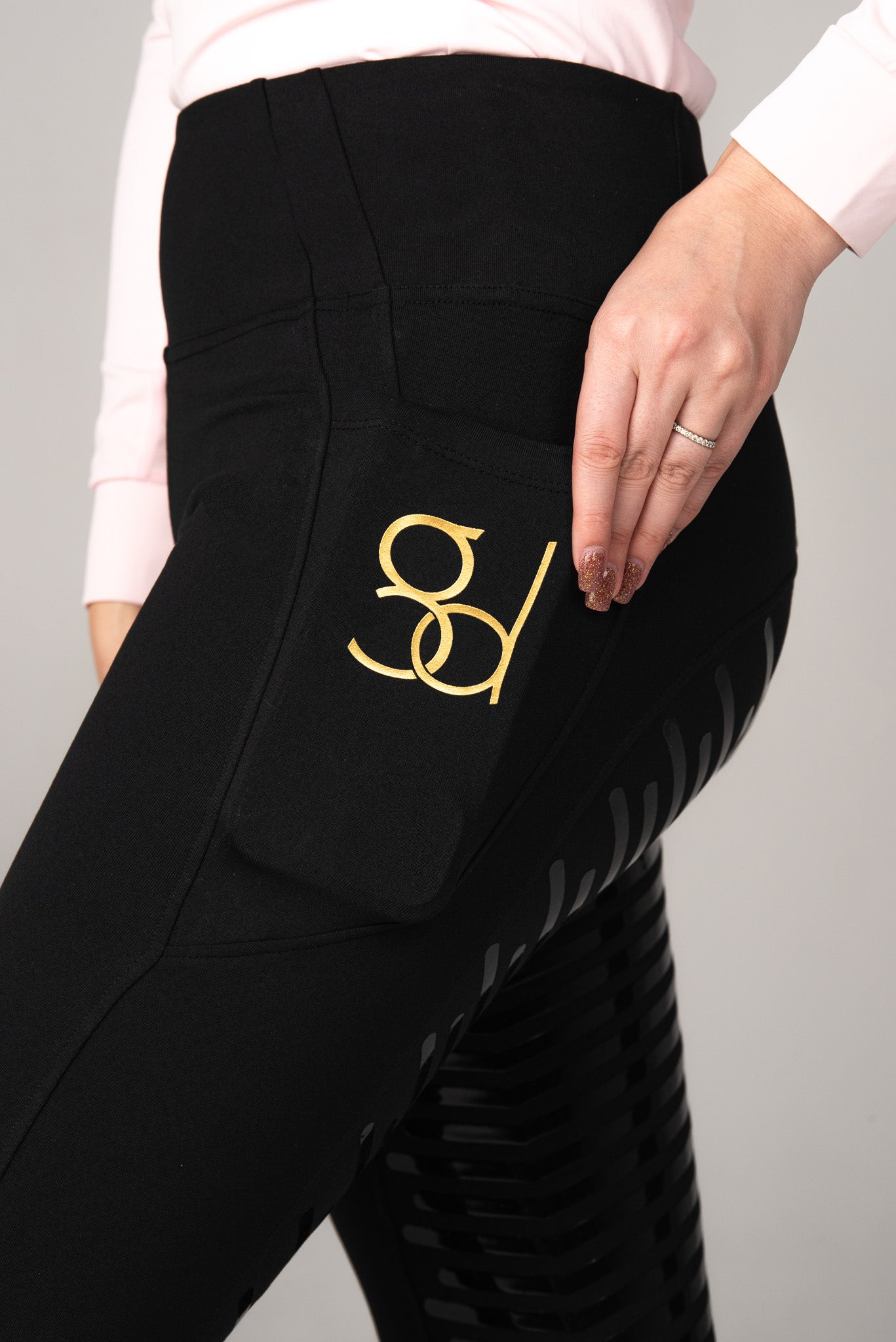 golden dapples pro grip riding leggings in black with gold logo and golden dapples pink sun shirt