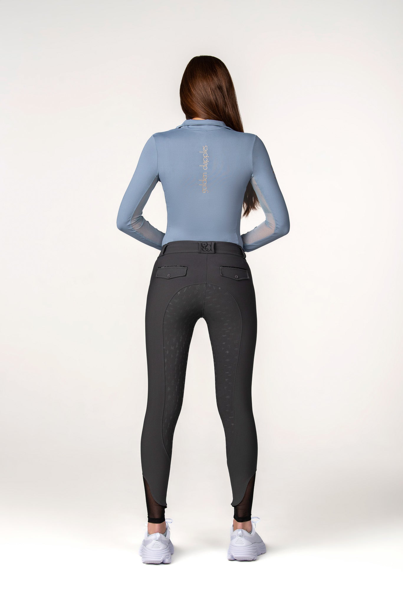 full body back of golden dapples grey pro breeches and blue sun shirt with gold logo